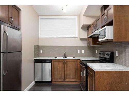 149 Pintail Place, Fort Mcmurray, AB - Indoor Photo Showing Kitchen With Double Sink With Upgraded Kitchen