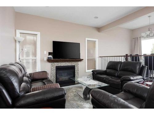 149 Pintail Place, Fort Mcmurray, AB - Indoor Photo Showing Living Room With Fireplace