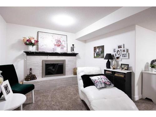 145 Kennedy Crescent, Fort Mcmurray, AB - Indoor Photo Showing Living Room With Fireplace