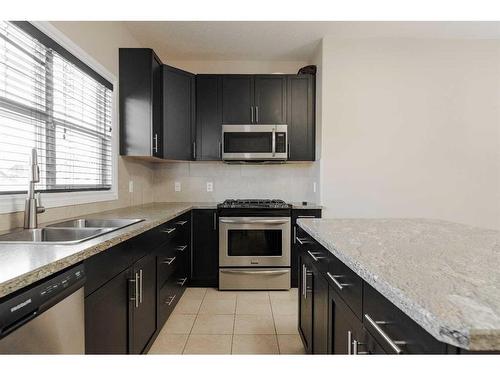 106 Merganser Crescent, Fort Mcmurray, AB - Indoor Photo Showing Kitchen With Double Sink