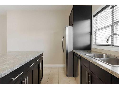 106 Merganser Crescent, Fort Mcmurray, AB - Indoor Photo Showing Kitchen With Double Sink