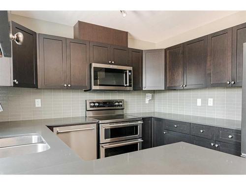 165-401 Athabasca Avenue, Fort Mcmurray, AB - Indoor Photo Showing Kitchen With Stainless Steel Kitchen With Double Sink