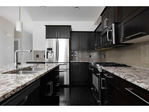 152 Collicott Drive, Fort Mcmurray, AB - Indoor Photo Showing Kitchen With Double Sink With Upgraded Kitchen