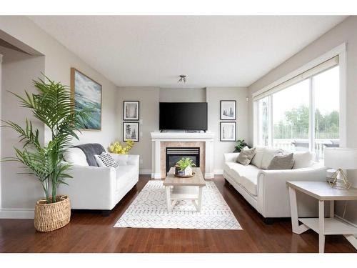 117 Merganser Place, Fort Mcmurray, AB - Indoor Photo Showing Living Room With Fireplace