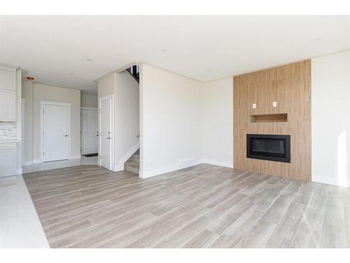 149 Shalestone Place, Fort Mcmurray, AB - Indoor Photo Showing Living Room With Fireplace