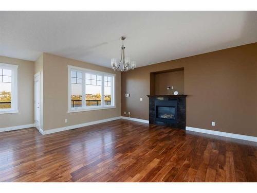 152 Snowy Owl Way, Fort Mcmurray, AB - Indoor Photo Showing Living Room With Fireplace