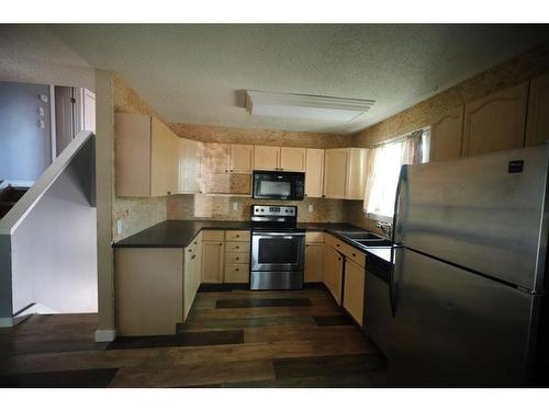 101 Bird Crescent, Fort Mcmurray, AB - Indoor Photo Showing Kitchen With Double Sink