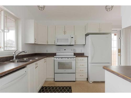 152 Webb Drive, Fort Mcmurray, AB - Indoor Photo Showing Kitchen With Double Sink