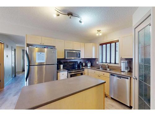 257 Rainbow Creek Drive, Fort Mcmurray, AB - Indoor Photo Showing Kitchen With Double Sink