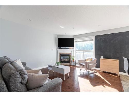 32-193 O'Coffey Crescent, Fort Mcmurray, AB - Indoor Photo Showing Living Room With Fireplace