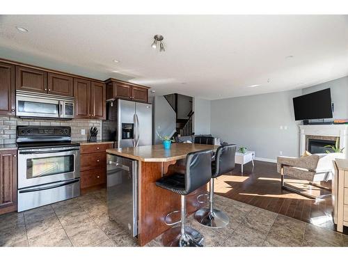 32-193 O'Coffey Crescent, Fort Mcmurray, AB - Indoor Photo Showing Kitchen With Fireplace