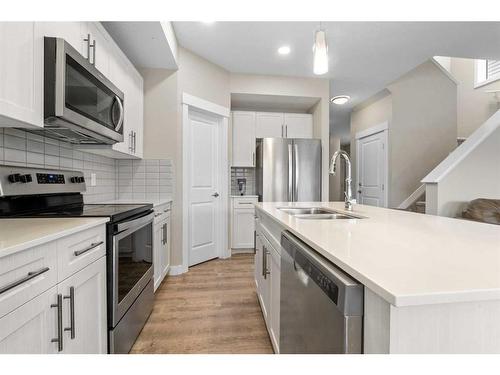 121 Collicott Drive, Fort Mcmurray, AB - Indoor Photo Showing Kitchen With Stainless Steel Kitchen With Double Sink With Upgraded Kitchen