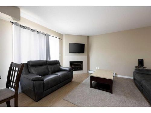 332-201 Abasand Drive, Fort Mcmurray, AB - Indoor Photo Showing Living Room With Fireplace