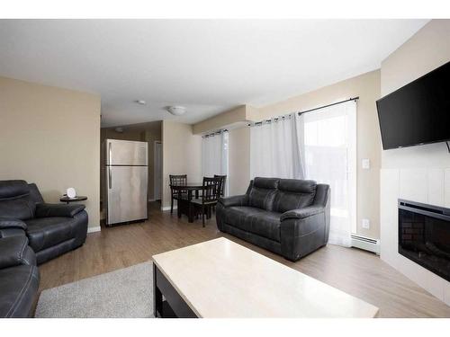 332-201 Abasand Drive, Fort Mcmurray, AB - Indoor Photo Showing Living Room With Fireplace