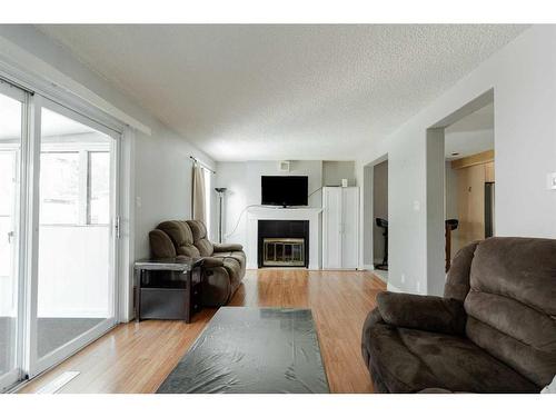 105 Graham Place, Fort Mcmurray, AB - Indoor Photo Showing Living Room With Fireplace