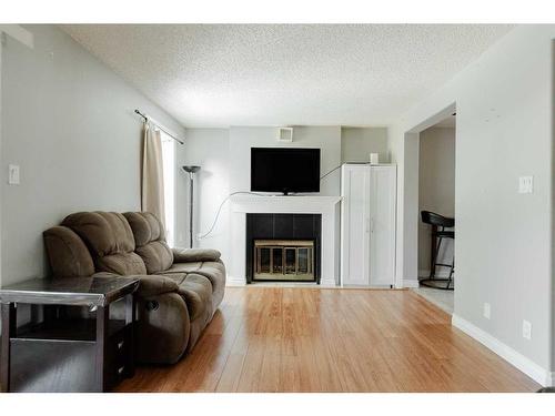 105 Graham Place, Fort Mcmurray, AB - Indoor Photo Showing Living Room With Fireplace