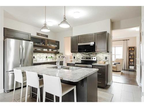 18-300 Sparrow Hawk Drive, Fort Mcmurray, AB - Indoor Photo Showing Kitchen With Double Sink With Upgraded Kitchen