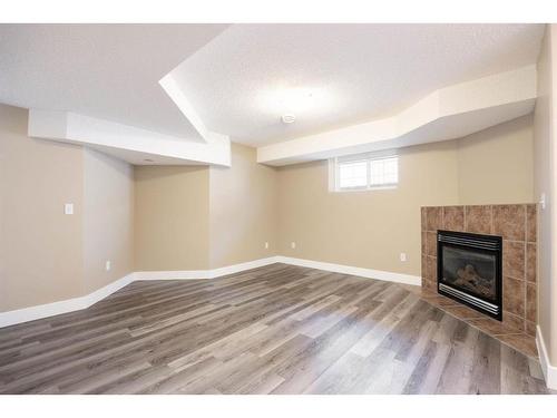 144 O'Coffey Crescent, Fort Mcmurray, AB - Indoor Photo Showing Other Room With Fireplace