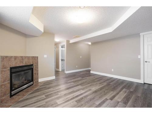 144 O'Coffey Crescent, Fort Mcmurray, AB - Indoor Photo Showing Other Room With Fireplace