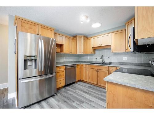 144 O'Coffey Crescent, Fort Mcmurray, AB - Indoor Photo Showing Kitchen With Stainless Steel Kitchen