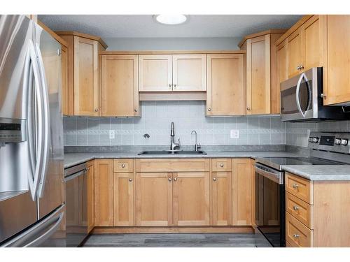 144 O'Coffey Crescent, Fort Mcmurray, AB - Indoor Photo Showing Kitchen With Stainless Steel Kitchen