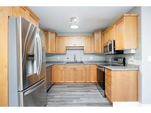 144 O'Coffey Crescent, Fort Mcmurray, AB - Indoor Photo Showing Kitchen With Stainless Steel Kitchen