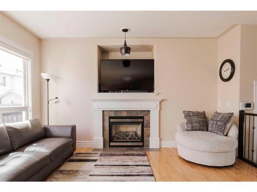 216 Pinnacle Place, Fort Mcmurray, AB - Indoor Photo Showing Living Room With Fireplace