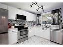 129 Rosslyn Street, Fort Mcmurray, AB  - Indoor Photo Showing Kitchen With Stainless Steel Kitchen With Upgraded Kitchen 