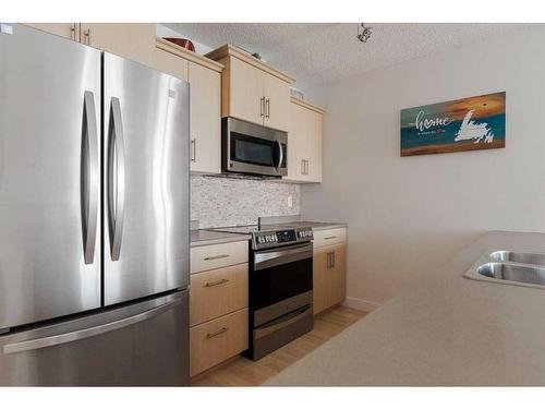 2514-135B Sandpiper Road, Fort Mcmurray, AB - Indoor Photo Showing Kitchen With Double Sink