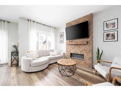 105 Arncliff Court, Fort Mcmurray, AB - Indoor Photo Showing Living Room With Fireplace