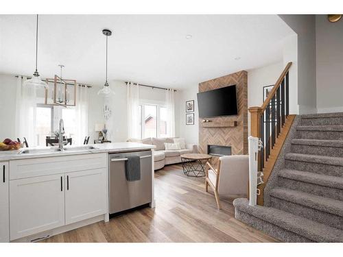 105 Arncliff Court, Fort Mcmurray, AB - Indoor Photo Showing Kitchen With Fireplace With Upgraded Kitchen