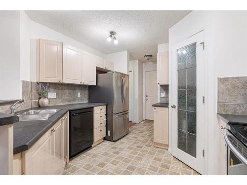 153 Cinnamon Street, Fort Mcmurray, AB - Indoor Photo Showing Kitchen With Double Sink