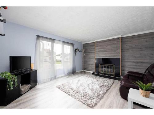 149 Kennedy Crescent, Fort Mcmurray, AB - Indoor Photo Showing Living Room With Fireplace