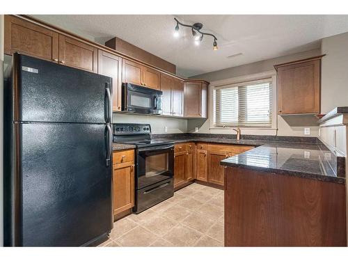 705-8535 Clearwater Drive, Fort Mcmurray, AB - Indoor Photo Showing Kitchen