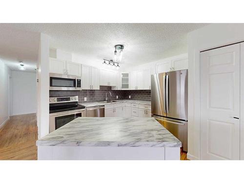 144 Cruickshank Road, Fort Mcmurray, AB - Indoor Photo Showing Kitchen With Stainless Steel Kitchen