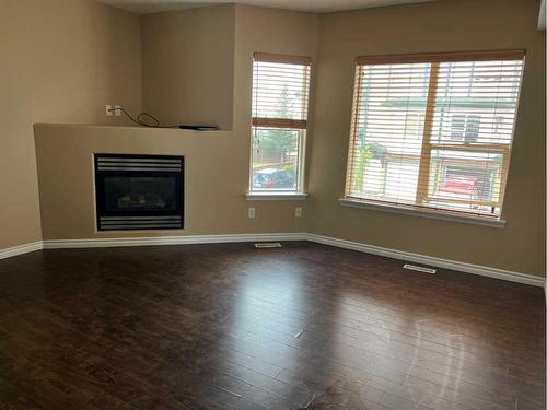 207-123 Arabian Drive, Fort Mcmurray, AB - Indoor Photo Showing Other Room With Fireplace