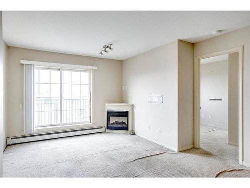 2408-200 Lougheed Drive, Fort Mcmurray, AB - Indoor Photo Showing Living Room With Fireplace