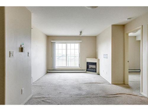 2408-200 Lougheed Drive, Fort Mcmurray, AB - Indoor Photo Showing Other Room With Fireplace