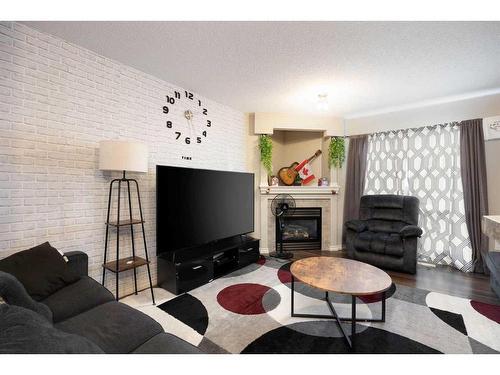 121 Sandstone Lane, Fort Mcmurray, AB - Indoor Photo Showing Living Room With Fireplace