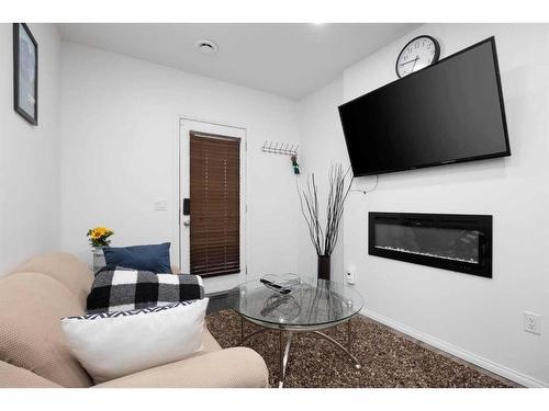 121 Sandstone Lane, Fort Mcmurray, AB - Indoor Photo Showing Living Room With Fireplace