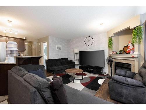 121 Sandstone Lane, Fort Mcmurray, AB - Indoor Photo Showing Living Room With Fireplace