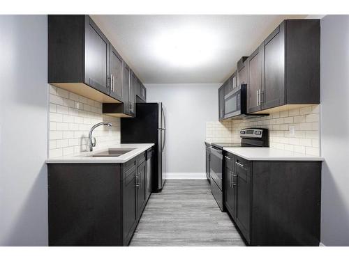 224 Siltstone Place, Fort Mcmurray, AB - Indoor Photo Showing Kitchen With Double Sink