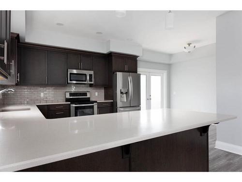 224 Siltstone Place, Fort Mcmurray, AB - Indoor Photo Showing Kitchen With Stainless Steel Kitchen With Double Sink With Upgraded Kitchen