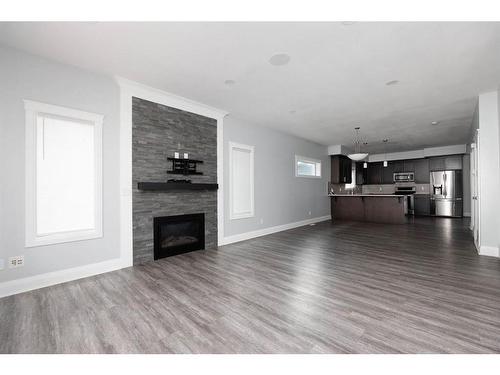 224 Siltstone Place, Fort Mcmurray, AB - Indoor Photo Showing Living Room With Fireplace