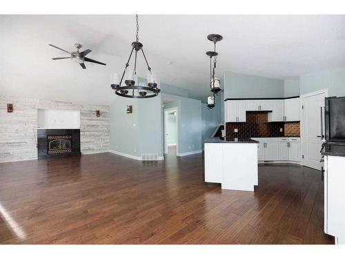 329 Mustang Road, Fort Mcmurray, AB - Indoor Photo Showing Kitchen With Fireplace