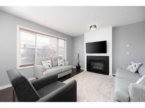 404 Fireweed Crescent, Fort Mcmurray, AB - Indoor Photo Showing Living Room With Fireplace