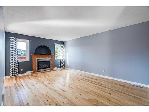 173 Pickles Crescent, Fort Mcmurray, AB - Indoor Photo Showing Living Room With Fireplace