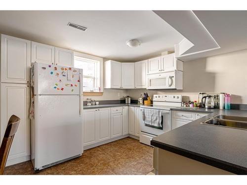 399 Cornwall Drive, Fort Mcmurray, AB - Indoor Photo Showing Kitchen With Double Sink