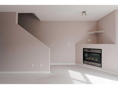 405-123 Arabian Drive, Fort Mcmurray, AB - Indoor Photo Showing Other Room With Fireplace