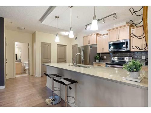 2107-204 Sparrow Hawk Drive, Fort Mcmurray, AB - Indoor Photo Showing Kitchen With Stainless Steel Kitchen With Double Sink With Upgraded Kitchen